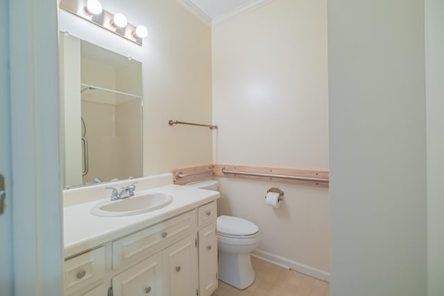 bathroom featuring vanity, crown molding, toilet, and walk in shower