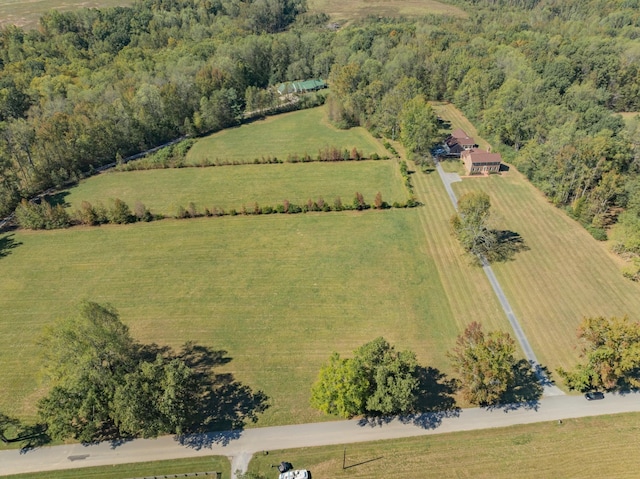 birds eye view of property with a rural view