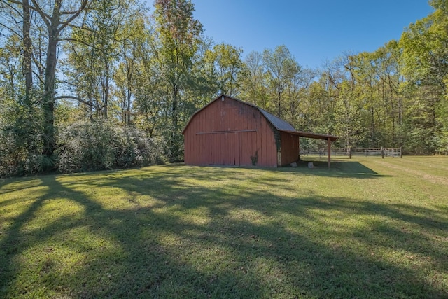 view of outbuilding with a lawn