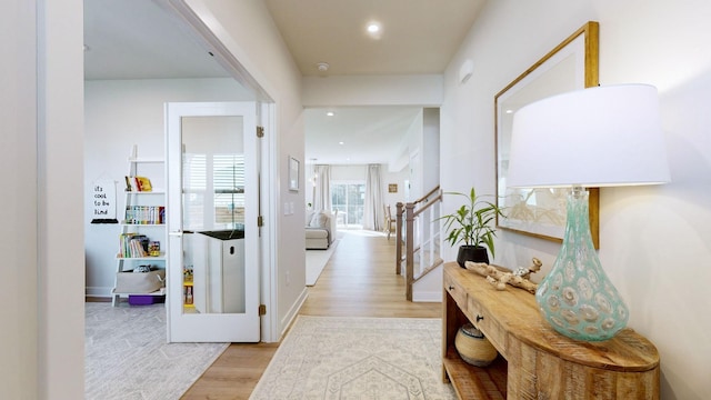 corridor featuring light hardwood / wood-style floors