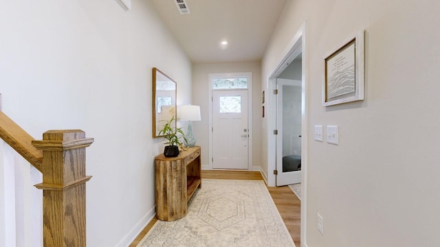 entryway featuring recessed lighting, light wood-type flooring, visible vents, and baseboards