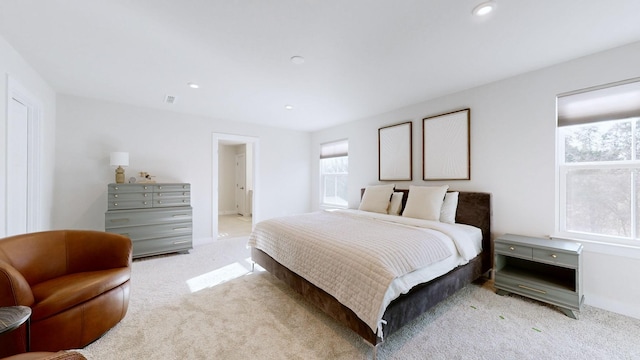 bedroom featuring recessed lighting and light colored carpet