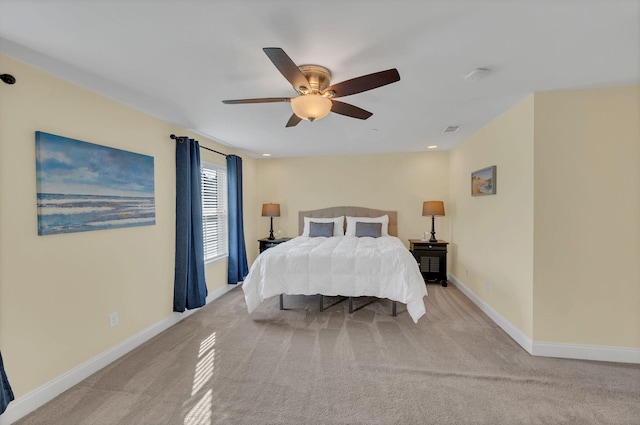 bedroom featuring ceiling fan and light colored carpet