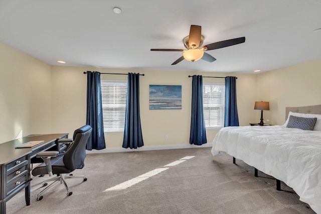 bedroom with light carpet and ceiling fan