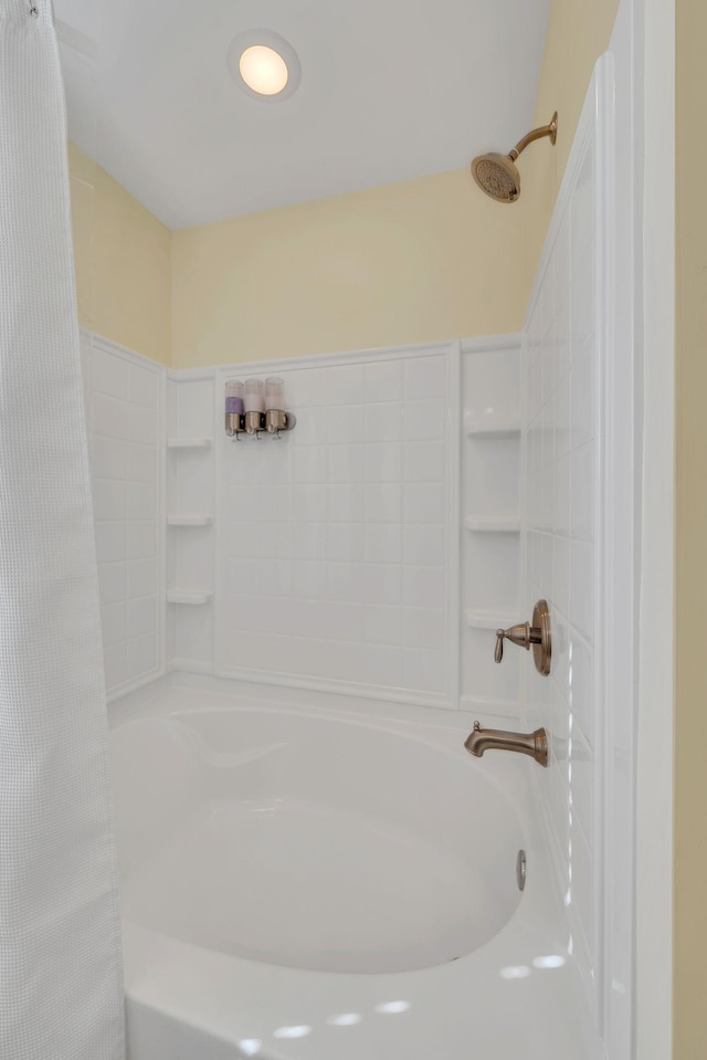 bathroom with shower / bath combination with curtain