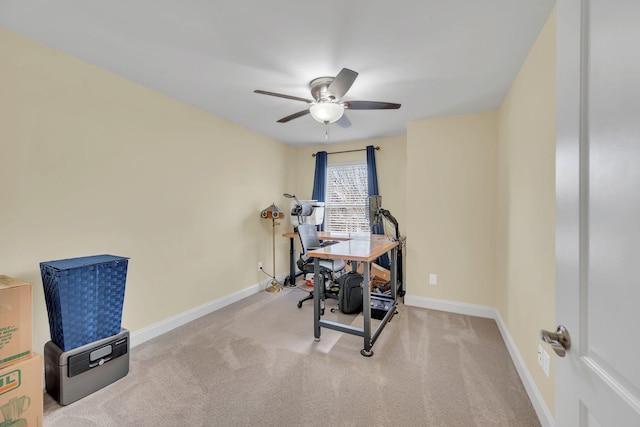 workout room featuring light colored carpet and ceiling fan