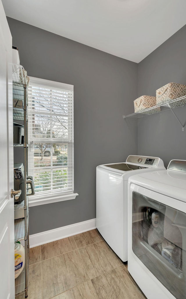 washroom featuring washing machine and clothes dryer