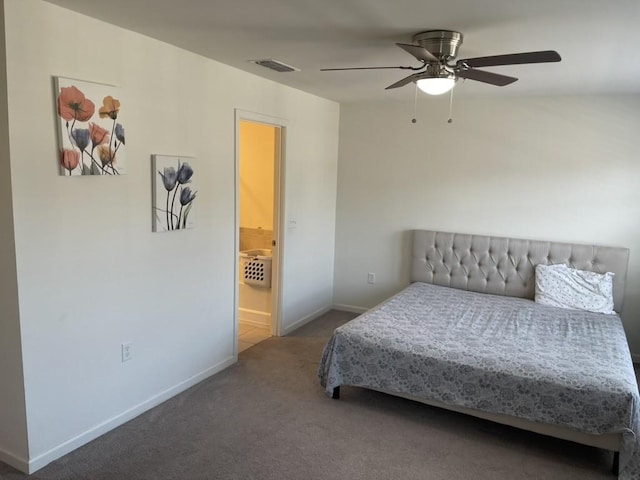 bedroom with carpet, ceiling fan, and ensuite bath