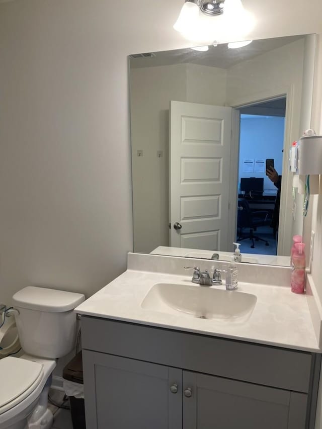 bathroom with vanity and toilet