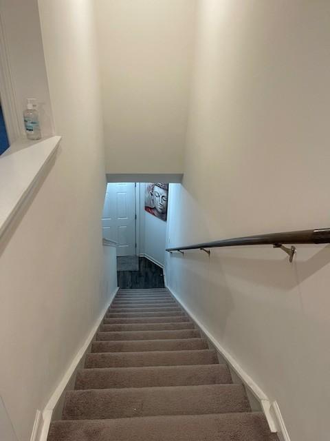 stairs with baseboards