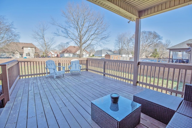 wooden terrace with a shed