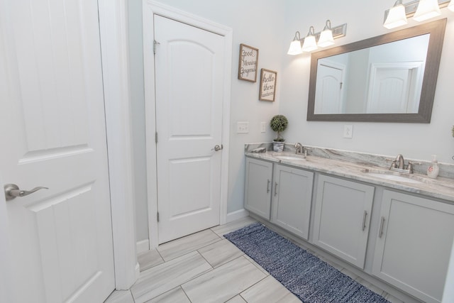 bathroom with tile patterned floors and vanity