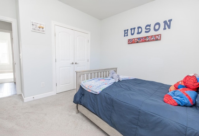 carpeted bedroom featuring a closet