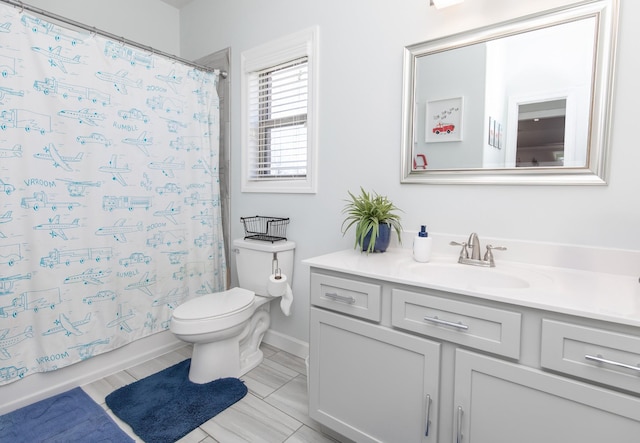 full bathroom with vanity, toilet, and shower / tub combo with curtain