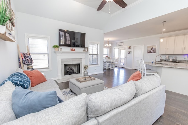 living room featuring ornamental molding, plenty of natural light, and dark hardwood / wood-style floors