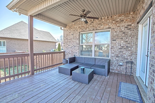 deck featuring outdoor lounge area and ceiling fan