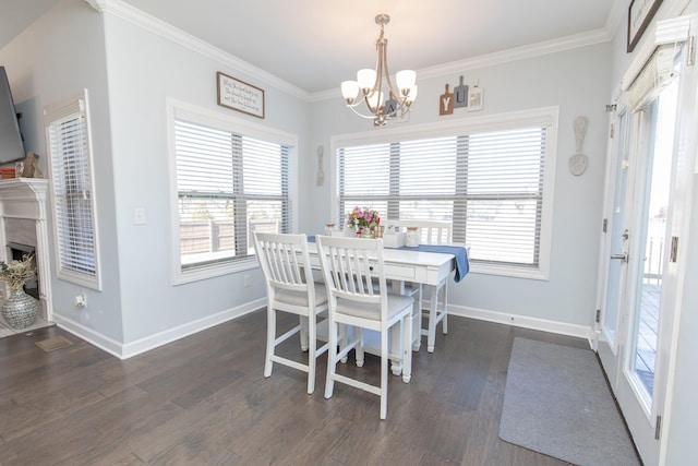 dining room with crown molding, dark hardwood / wood-style flooring, and an inviting chandelier