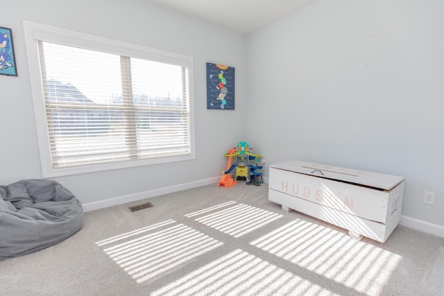 bedroom with light colored carpet