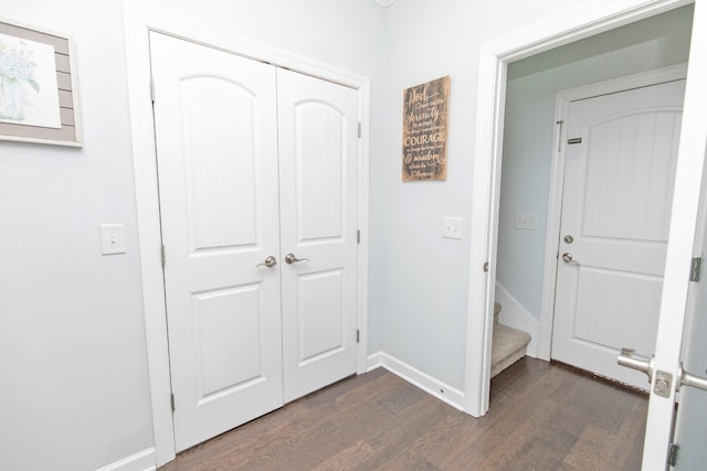 corridor featuring dark hardwood / wood-style floors