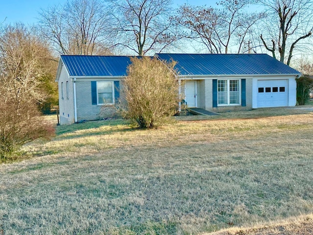 ranch-style home featuring a garage and a front yard