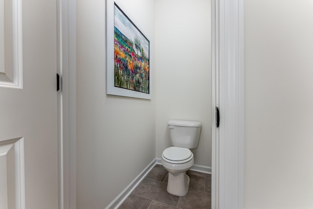 bathroom with tile patterned floors and toilet