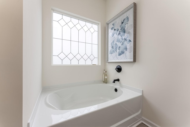 bathroom with a washtub