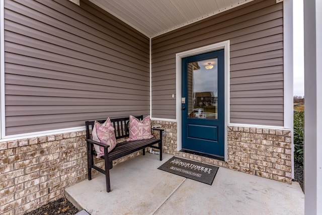 doorway to property with a porch