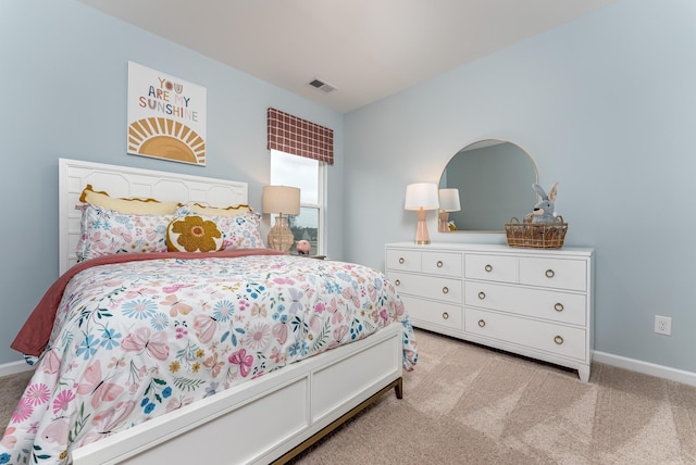 bedroom with light colored carpet