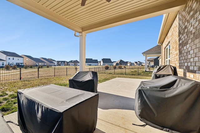 view of patio featuring a grill and ceiling fan