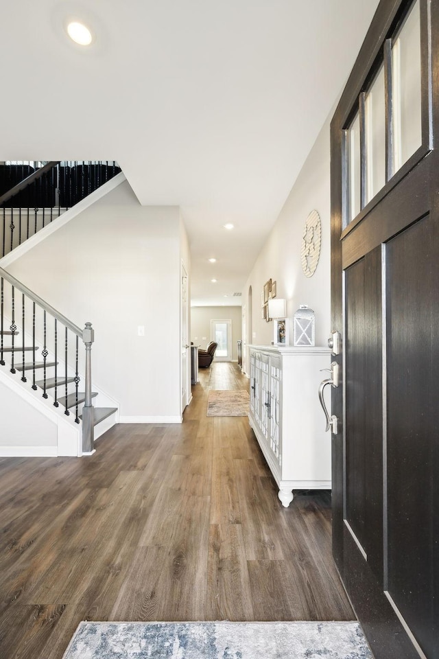 entryway with dark wood-type flooring