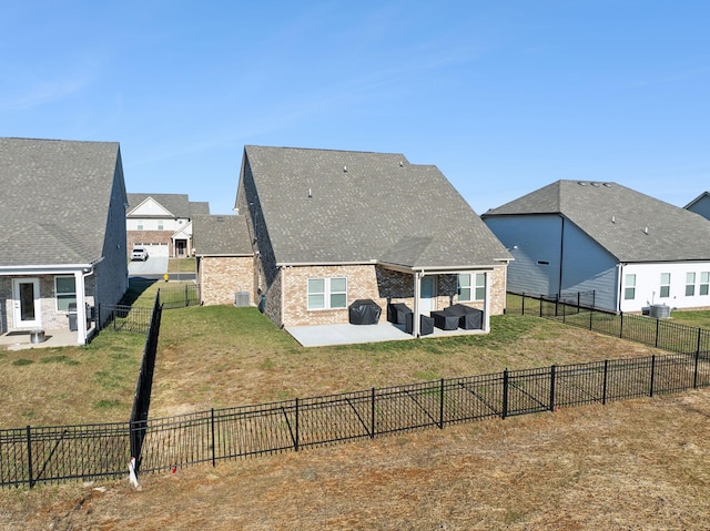 back of property with an outdoor hangout area, a yard, and a patio area