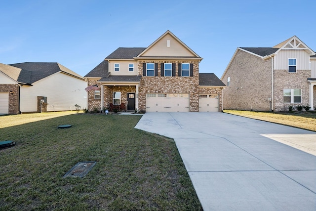 view of front of house with a garage and a front lawn