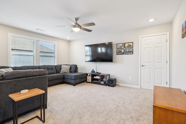 living room featuring carpet floors and ceiling fan