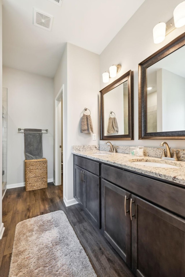 bathroom featuring vanity and hardwood / wood-style floors