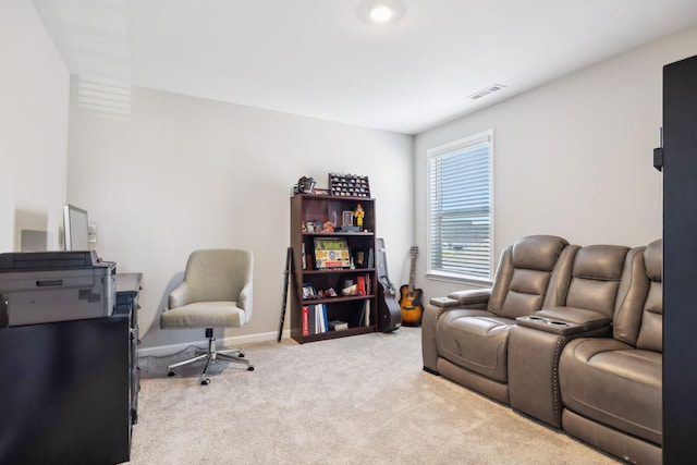 living area with light carpet