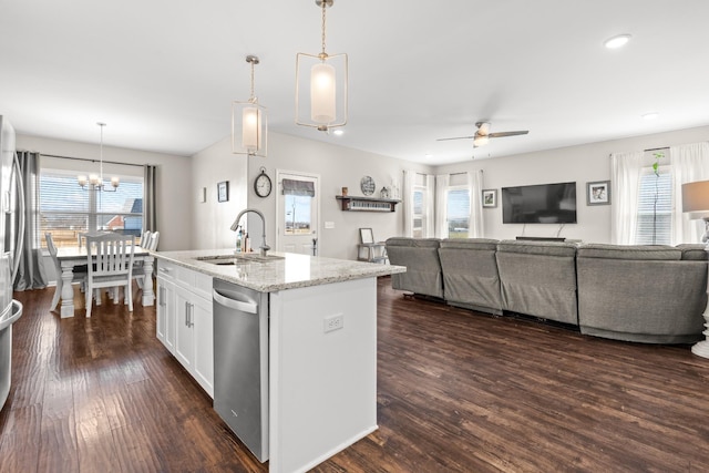 kitchen featuring sink, an island with sink, white cabinets, decorative light fixtures, and stainless steel dishwasher