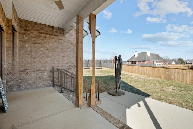 view of patio featuring ceiling fan