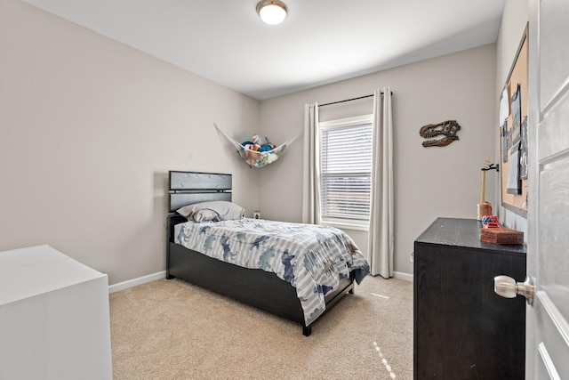 bedroom featuring light colored carpet