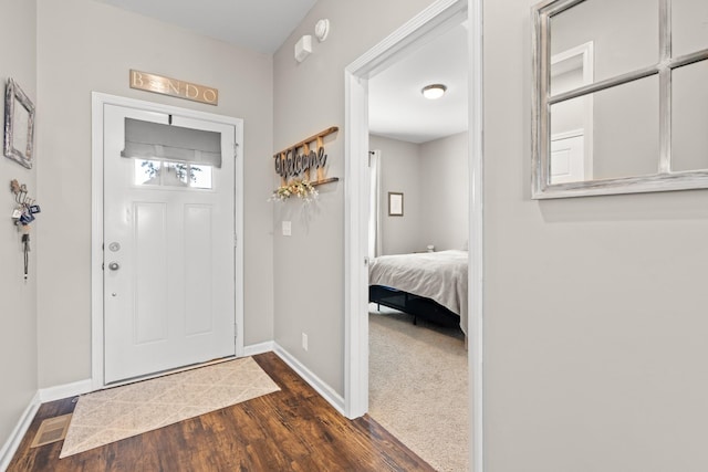 entrance foyer with dark wood-type flooring