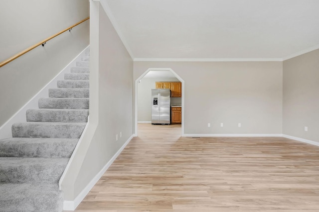 interior space with crown molding and hardwood / wood-style flooring