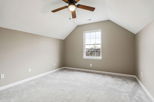 bonus room featuring ceiling fan, vaulted ceiling, and carpet