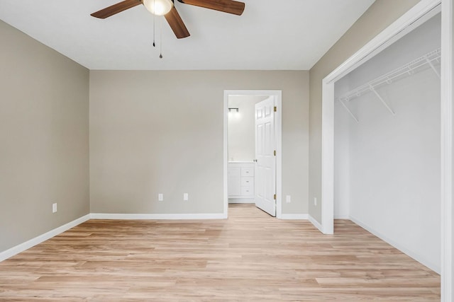 unfurnished bedroom with light hardwood / wood-style floors, a closet, ceiling fan, and ensuite bathroom