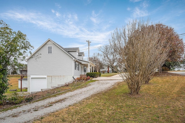 view of property exterior with a yard and a garage