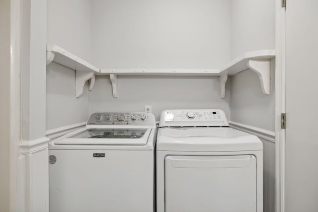 laundry area with independent washer and dryer