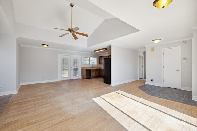 unfurnished living room with ornamental molding, ceiling fan, and light hardwood / wood-style flooring