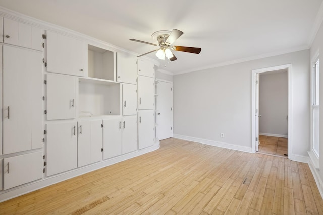 unfurnished bedroom with ornamental molding, ceiling fan, and light hardwood / wood-style floors