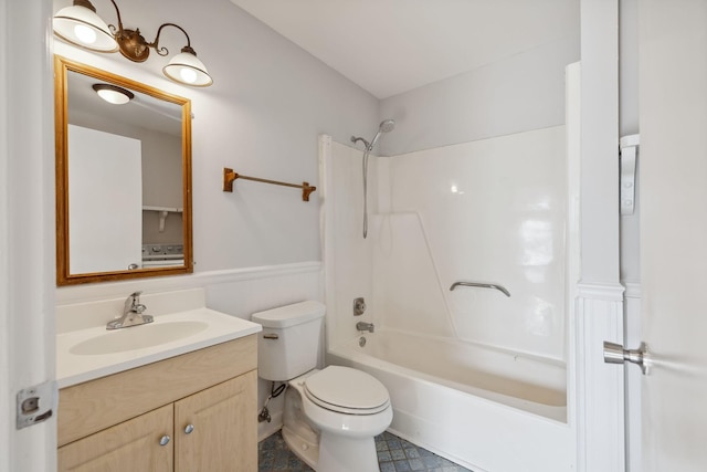 full bathroom with vanity, toilet, and washtub / shower combination