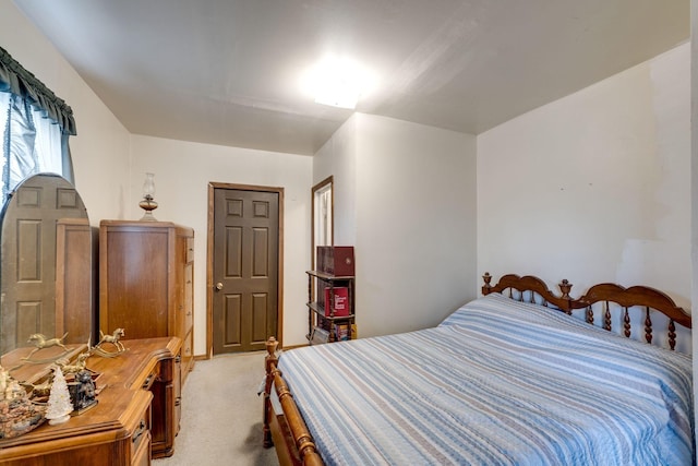 bedroom featuring light carpet