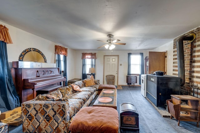 living room with ceiling fan and carpet flooring