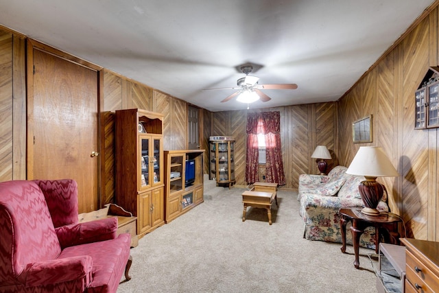 carpeted living room featuring ceiling fan